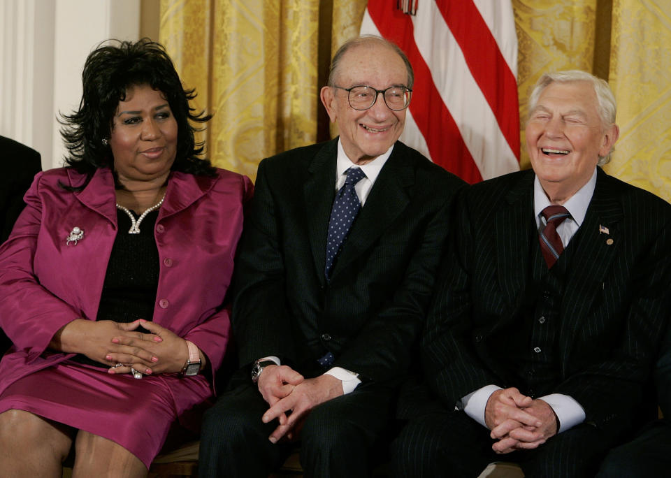 WASHINGTON - NOVEMBER 09: Outgoing Federal Reserve Board Chairman Alan Greenspan (C) smiles during the reading of his bio while seated next to singer Aretha Franklin (L) and actor Andy Griffith before recieving the Medal of Freedom from U.S. President George W. Bush during a ceremony at the White House November 9, 2005 in Washington DC. Bush presented 14 Medals of Freedom to recipients including retiring Federal Reserve Chairman Alan Greenspan and Aretha Franklin during the ceremony. (Photo by Mark Wilson/Getty Images)