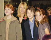 <p>(L-R) Rupert Grint, author J.K. Rowling, Daniel Radcliffe and Emma Watson at the UK Film Premiere of 'Harry Potter And The Philosopher's Stone' on November 4, 2001. Such a bunch of cuties!</p>