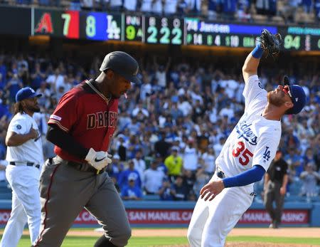 Mar 31, 2019; Los Angeles, CA, USA; Arizona Diamondbacks center fielder Adam Jones (10) flies out to Los Angeles Dodgers center fielder Cody Bellinger (35) giving relief pitcher Kenley Jansen (74) a save in the ninth inning of the game at Dodger Stadium. Mandatory Credit: Jayne Kamin-Oncea-USA TODAY Sports