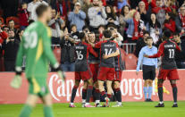 Toronto FC forward Federico Bernardeschi (10) celebrates with teammates after scoring a goal that was later overturned upon video replay during first-half MLS soccer match action against FC Dallas in Toronto, Saturday, May 4, 2024. (Christopher Katsarov/The Canadian Press via AP)