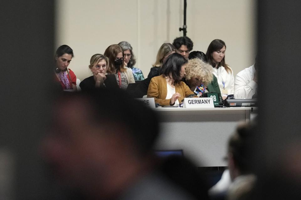 Germany's climate envoy Jennifer Morgan, right, and Germany Foreign Minister Annalena Baerbock talk while attending negotiations at the COP28 U.N. Climate Summit, Monday, Dec. 11, 2023, in Dubai, United Arab Emirates. (AP Photo/Rafiq Maqbool)