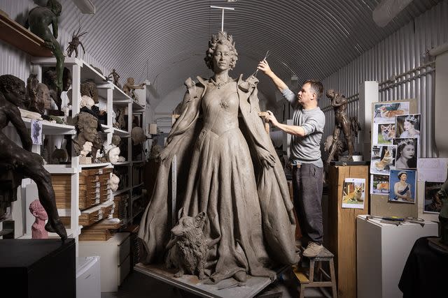 <p>Geoff Pugh/Telegraph</p> Hywel Brân Pratley and his new statue of Queen Elizabeth.