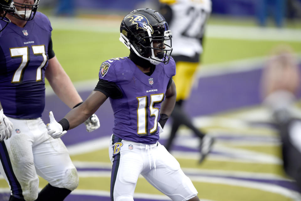 Baltimore Ravens wide receiver Marquise Brown reacts after catching a touchdown pass from quarterback Lamar Jackson, not visible, during the second half of an NFL football game against the Pittsburgh Steelers, Sunday, Nov. 1, 2020, in Baltimore. (AP Photo/Gail Burton)