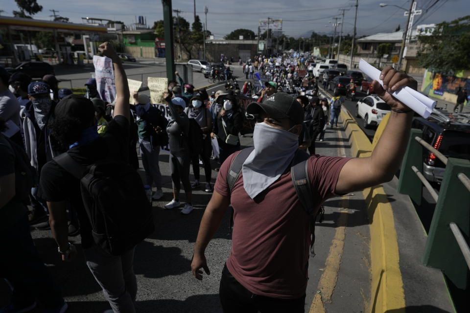 People march to protest against government of President Alejandro Giammattei in Guatemala City, Thursday, Aug. 11, 2022. Student and peasant sectors called for the march to protest everything from government corruption to the high cost of living. (AP Photo/Moises Castillo)