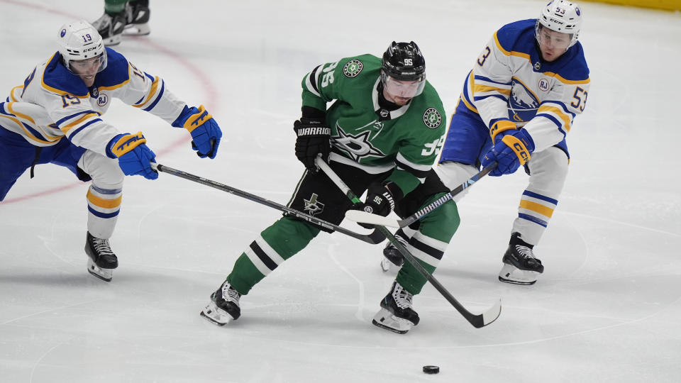 Dallas Stars center Matt Duchene (95) skates for the puck against Buffalo Sabres center Peyton Krebs (19) and left wing Jeff Skinner (53) during the third period an NHL hockey game in Dallas, Tuesday, April 9, 2024. (AP Photo/LM Otero)