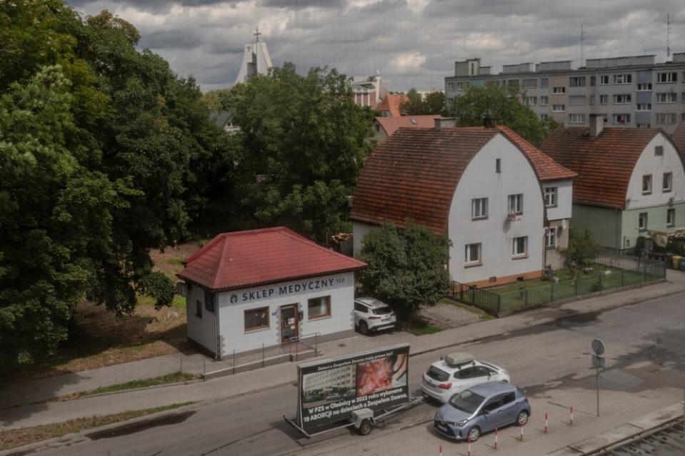 Anti-abortion activists protest regularly in front of the Olesnica hospital. On July 28, a car carrying a banner with photos of mutilated fetuses drives by.<span class="copyright">Kasia Strek for TIME</span>