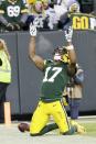 Green Bay Packers' Davante Adams celebrates his touchdown catch during the second half of an NFL divisional playoff football game against the Seattle Seahawks Sunday, Jan. 12, 2020, in Green Bay, Wis. (AP Photo/Mike Roemer)