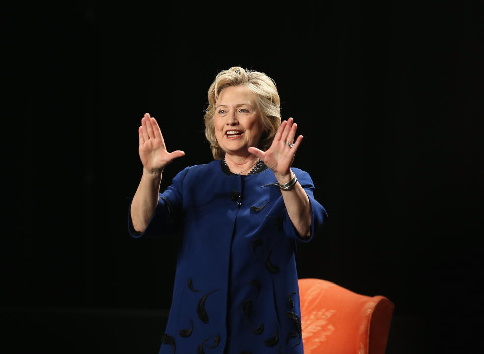 MIAMI, FL - FEBRUARY 26:  Hillary Rodham Clinton, Former Secretary of State flashes a U symbol before speaking speaking during an event at the University of Miamis BankUnited Center on February 26, 2014 in Coral Gables, Florida. Clinton is reported to be mulling a second presidential run.  (Photo by Joe Raedle/Getty Images)