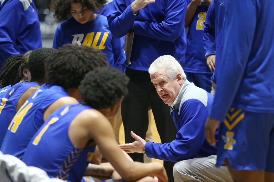 Irondequoit Eagles head coach Chris Cardon huddles up his team late in the fourth quarter during their Class A1 Championship final Saturday, March 4, 2023 a the Blue Cross Arena. 