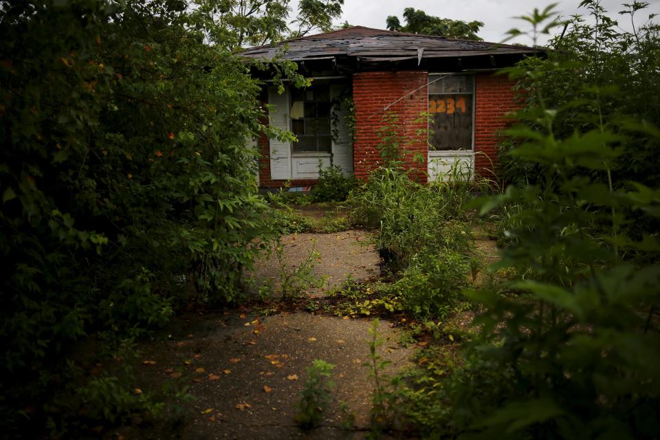 An abandoned house after Hurricane Katrina is seen in the Lower Ninth Ward neighborhood of New Orleans, Louisiana, August 18, 2015. (REUTERS/Carlos Barria)