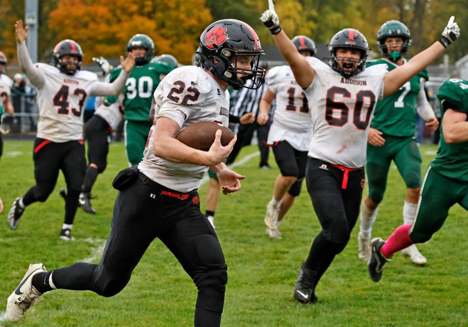 Addison's Spencer Brown runs in for a touchdown during Saturday's Cascades Conference championship game at Napoleon.