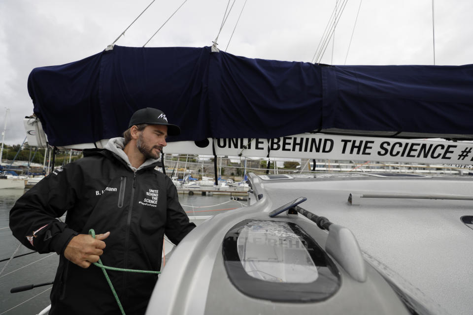 Skipper Boris Herrmann works on the boat Malizia as it is moored in Plymouth, England Tuesday, Aug. 13, 2019. Greta Thunberg, the 16-year-old climate change activist who has inspired student protests around the world, is heading to the United States this week - in a sailboat. (AP Photo/Kirsty Wigglesworth)