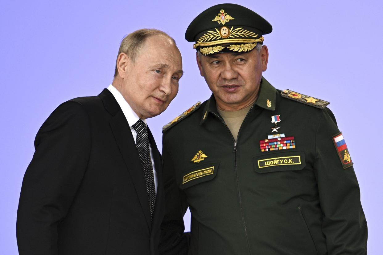 Russia's President Vladimir Putin and Russian Defense Minister Sergei Shoigu attend the opening of the Army 2022 International Military and Technical Forum in the Patriot Park outside Moscow, Russia, Monday, Aug. 15, 2022. (Sputnik, Kremlin Pool Photo via AP)