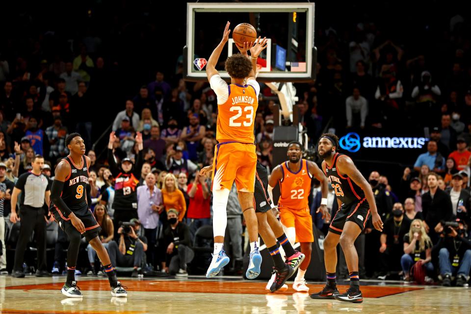 Mar 4, 2022; Phoenix, Arizona, USA; Phoenix Suns forward Cameron Johnson (23) shoots the game-winning shot in the closing seconds of the game against the New York Knicks at Footprint Center.