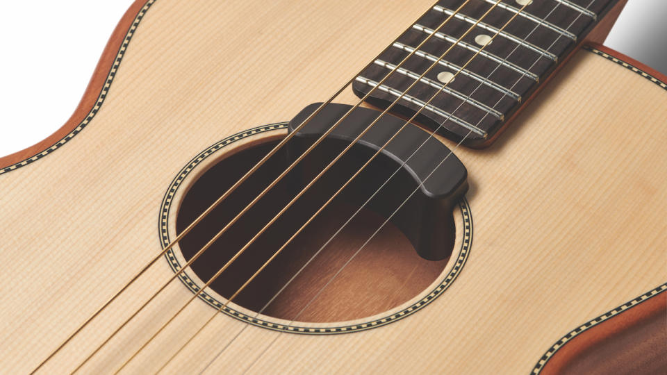 Close up around the soundhole of a Fender Highway Series Parlor electro acoustic guitar