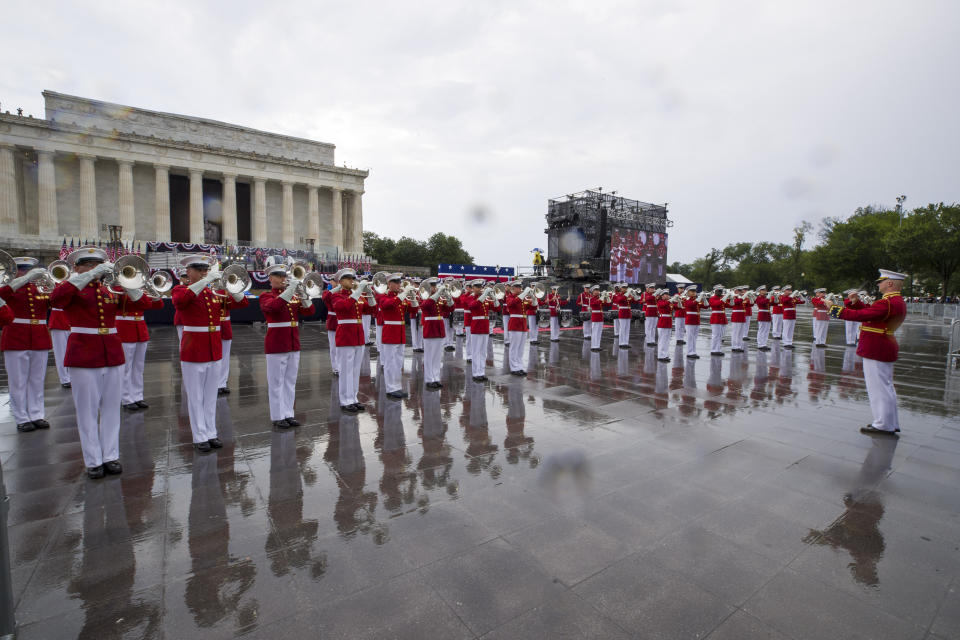 The U.S. Marine Corps Drum and Bugle Corps performs in the rain during an Independence Day celebration in front of the Lincoln Memorial, Thursday, July 4, 2019, in Washington. (AP Photo/Alex Brandon)