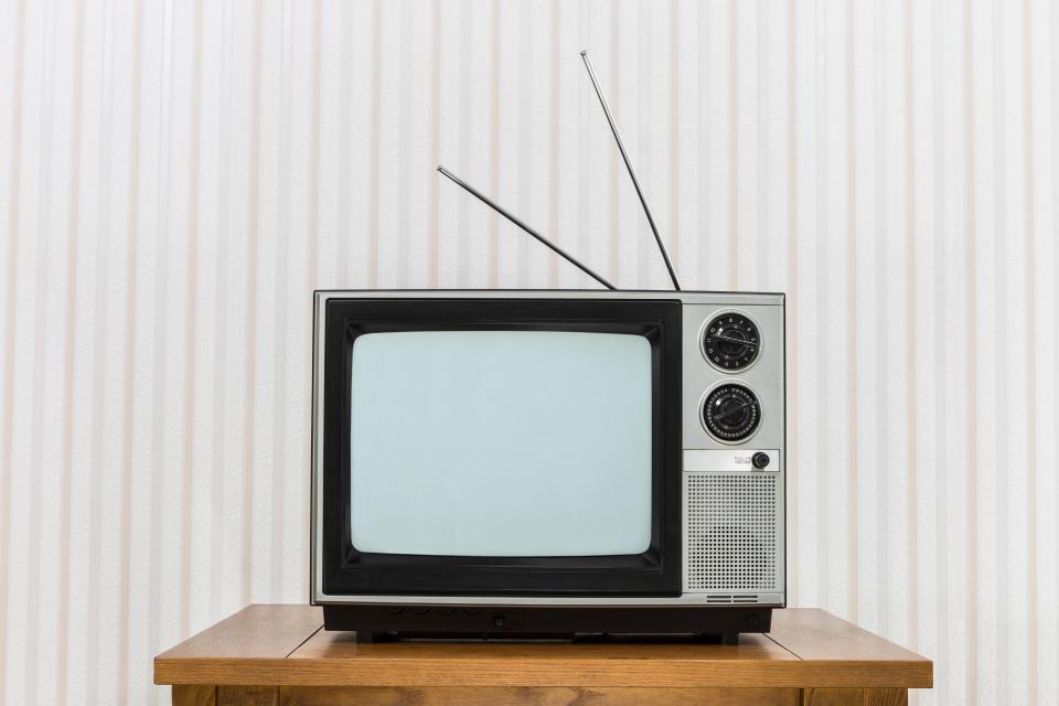 <h1 class="title">Old Television with Antenna on Wood Table</h1><cite class="credit">Photo: Via Getty Images</cite>