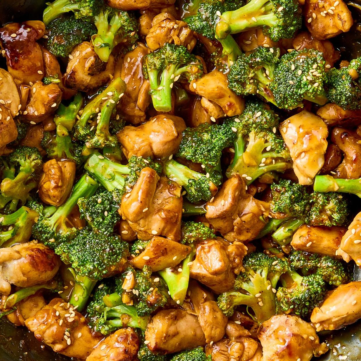 stir fried pieces of chicken and broccoli