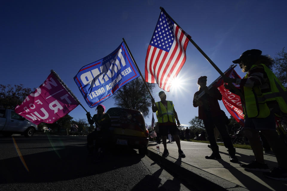 FILE - In this Jan. 6, 2021 file photo, people attend a rally in support of President Donald Trump outside Thousand Oaks City Hall in Thousand Oaks, Calif. Republicans have had wild success this year passing voting restrictions in states they control politically, from Georgia to Iowa to Texas. (AP Photo/Ashley Landis, File)