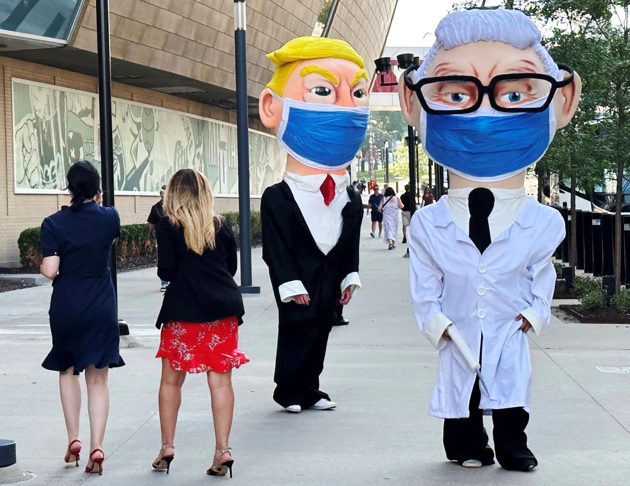 Demonstrators dressed as Republican presidential candidate and former President Donald Trump and former NIH National Institute of Allergy and Infectious Diseases Director Anthony Fauci (REUTERS)