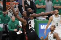 Miami Heat's Bam Adebayo (13) dunks against Boston Celtics' Jaylen Brown during the second half of Game 3 of the NBA basketball playoffs Eastern Conference finals Saturday, May 21, 2022, in Boston. (AP Photo/Michael Dwyer)