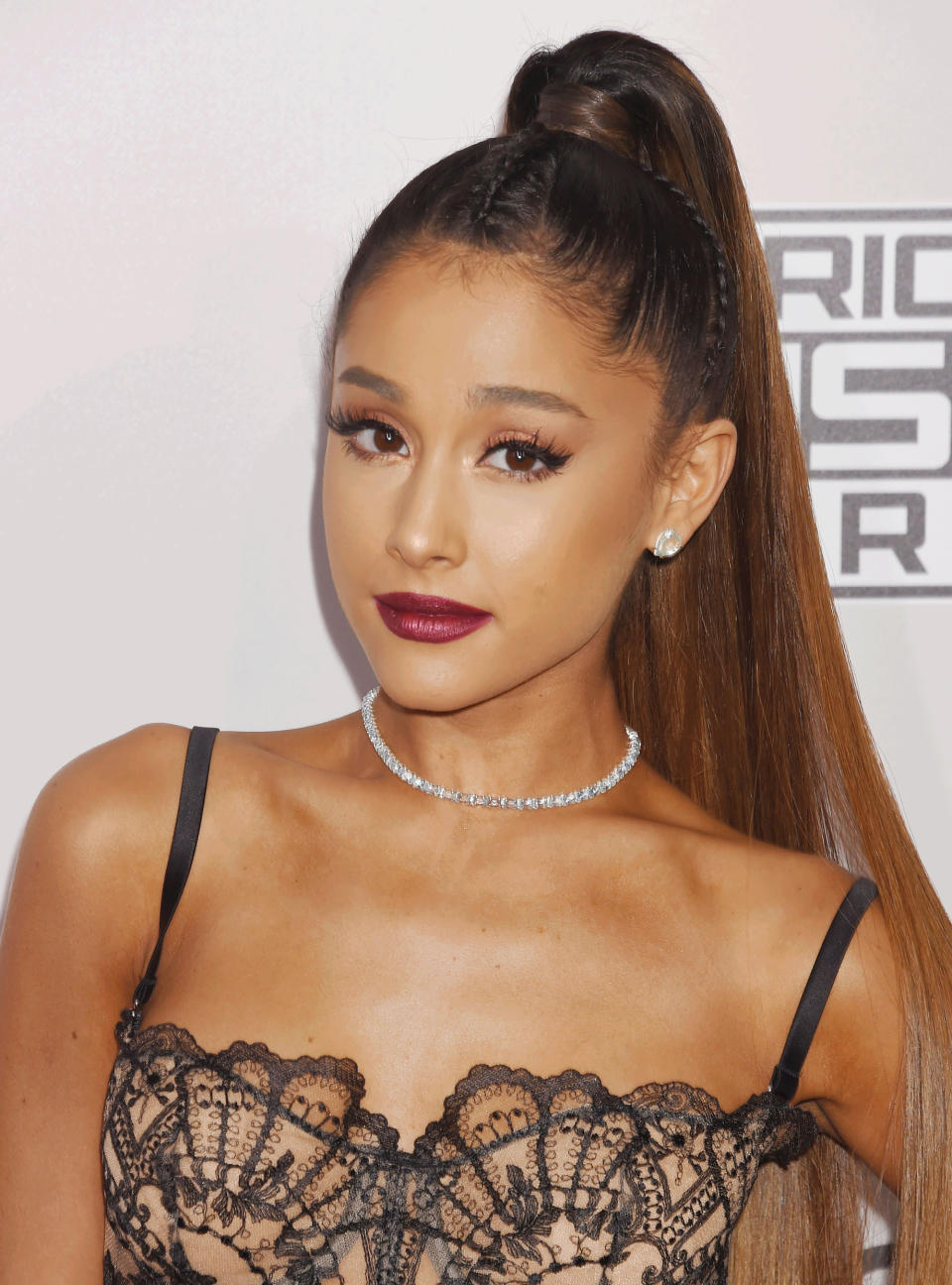 <p>For an edgy update on fall's signature wine-stained lip, Grande's makeup artist Daniel Chinchilla filled in the singer's lips with Kylie Cosmetics' Merry Liner followed by a topcoat of the brand's Metal Lipstick in Dancer. </p>