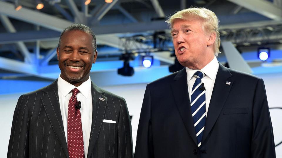 PHOTO: In this Sept. 16, 2015 file photo, Republican presidential hopefuls, retired neurosurgeon Ben Carson, left, smiles as real estate magnate Donald Trump speaks after they arrived on stage for the Republican presidential debate in Simi Valley, Calif. (Robyn Beck/AFP via Getty Images, FILE)