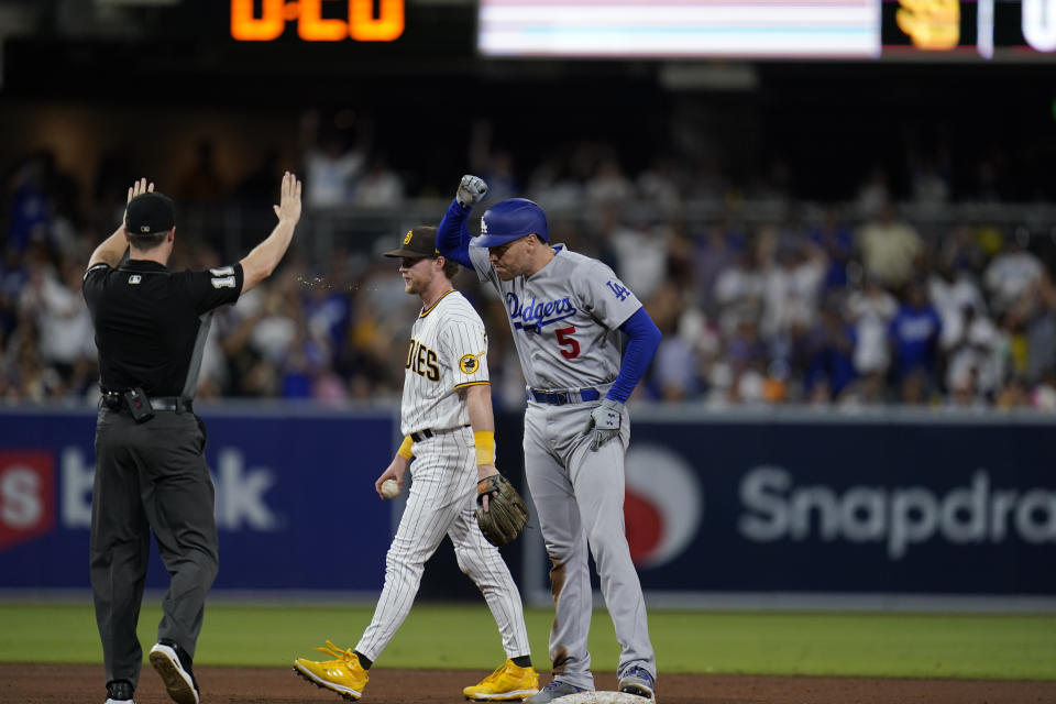 Los Angeles Dodgers' Freddie Freeman (5) reacts after hitting an RBI-double during the fifth inning of a baseball game against the San Diego Padres, Saturday, Sept. 10, 2022, in San Diego. (AP Photo/Gregory Bull)