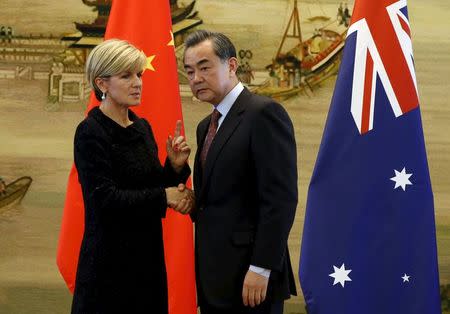 Australian Foreign Minister Julie Bishop (L) talks with Chinese Foreign Minister Wang Yi after their joint news conference at the Ministry of Foreign Affairs in Beijing, China, February 17, 2016. REUTERS/Kim Kyung-Hoon TPX IMAGES OF THE DAY