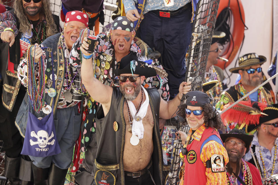 Parade Grand Marshal and comedian Bert Kreischer stands shirtless among hundreds of pirates aboard the Jose Gasparilla pirate ship before the start of the Gasparilla Invasion Parade on Saturday, Jan. 27, 2024, in Tampa. (Louis Santana/Tampa Bay Times via AP)