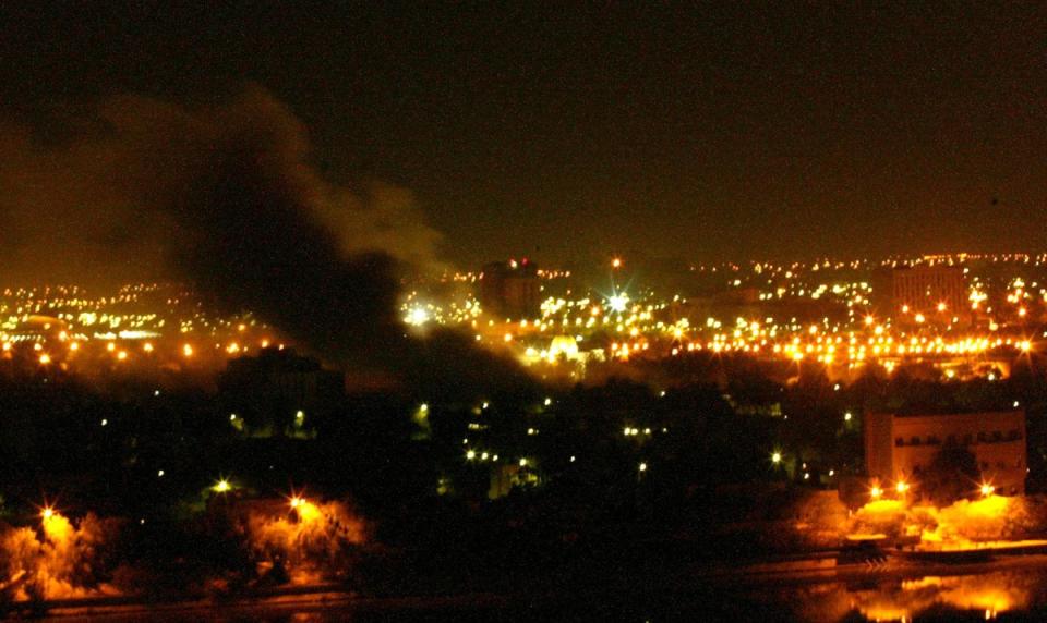 Smoke covers Baghdad on 20 March 2003 (AFP/Getty)