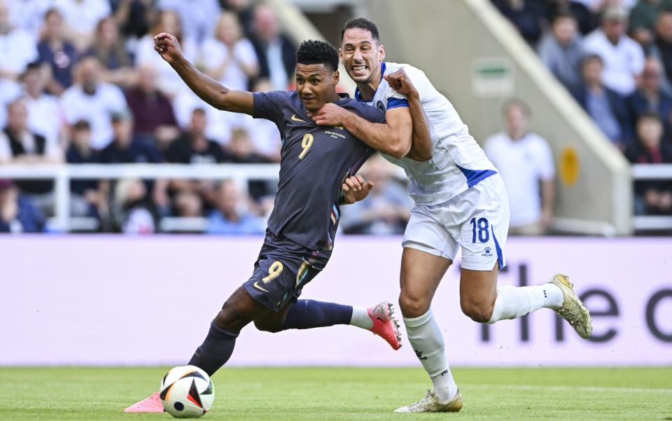 Ollie Watkins of England battles with Nikola Kati of Bosnia & Herzegovina during the international friendly match between England and Bosnia & Herzegovina at St James' Park on June 3, 2024 in Newcastle upon Tyne, England