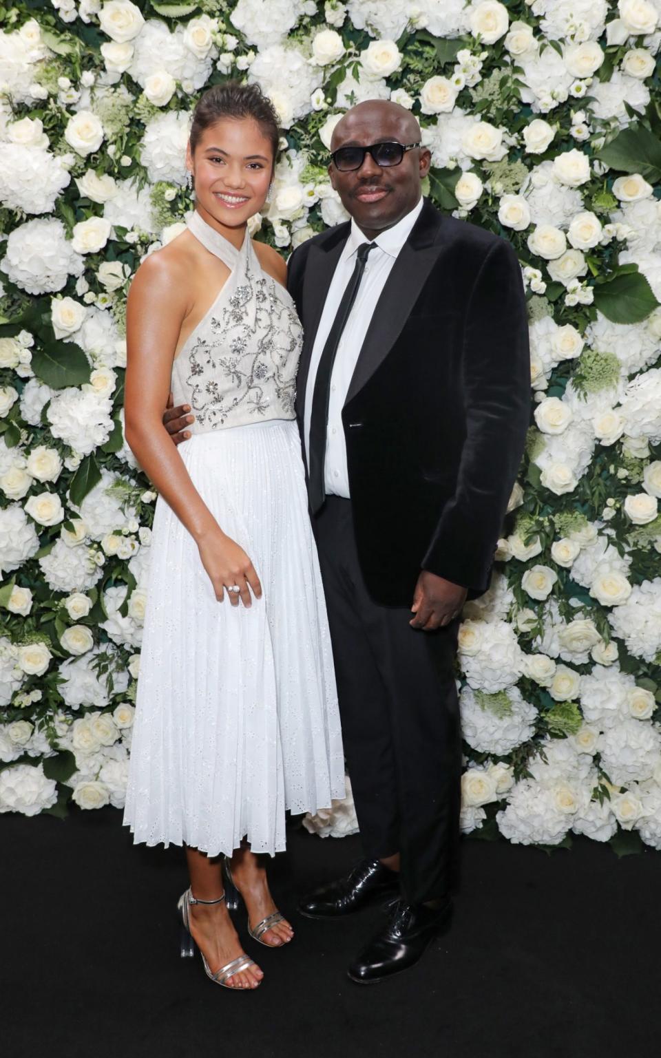 Emma Raducanu at the Vogue x Tiffany LFW party with British Vogue editor Edward Enninful. Emma is wearing jewellery by Tiffany, and a look from Erdem's new collection - Getty