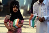 <p>Indian schoolchildren hold national flags during an event to celebrate the country’s Republic Day in Mumbai on January 26, 2016. Celebrations are underway across India as the country marks its 67th Republic Day. </p>