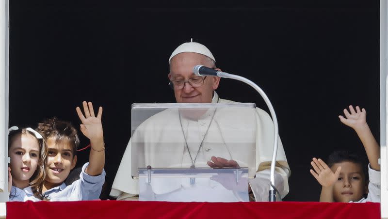 Pope Francis, flanked by children from the five continents, speaks from his studio’s window to the faithful gathered for the traditional Sunday’s noon blessing in St. Peter’s Square at The Vatican on  Sunday, Oct. 1, 2023.
