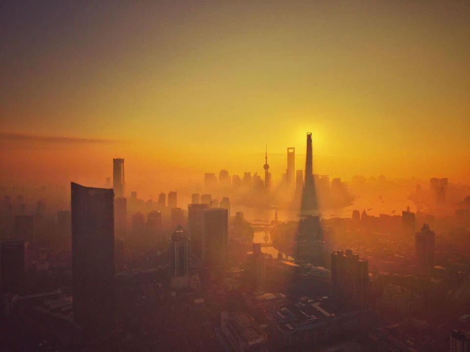 <p>A blanket of heavy smog covered the city of Shanghai this week, pictured here at sunrise. (Imaginechina/Rex)</p>