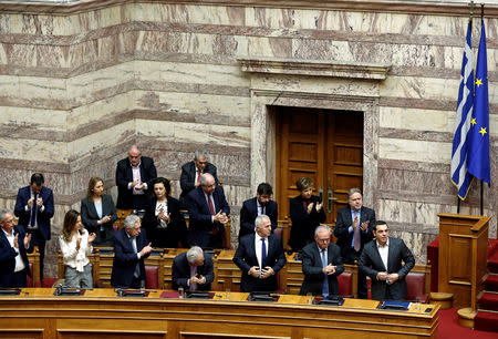 Greek Prime Minister Alexis Tsipras is applauded by lawmakers after his speech during a parliamentary session on confidence vote in Athens, Greece, January 15, 2019. REUTERS/Costas Baltas