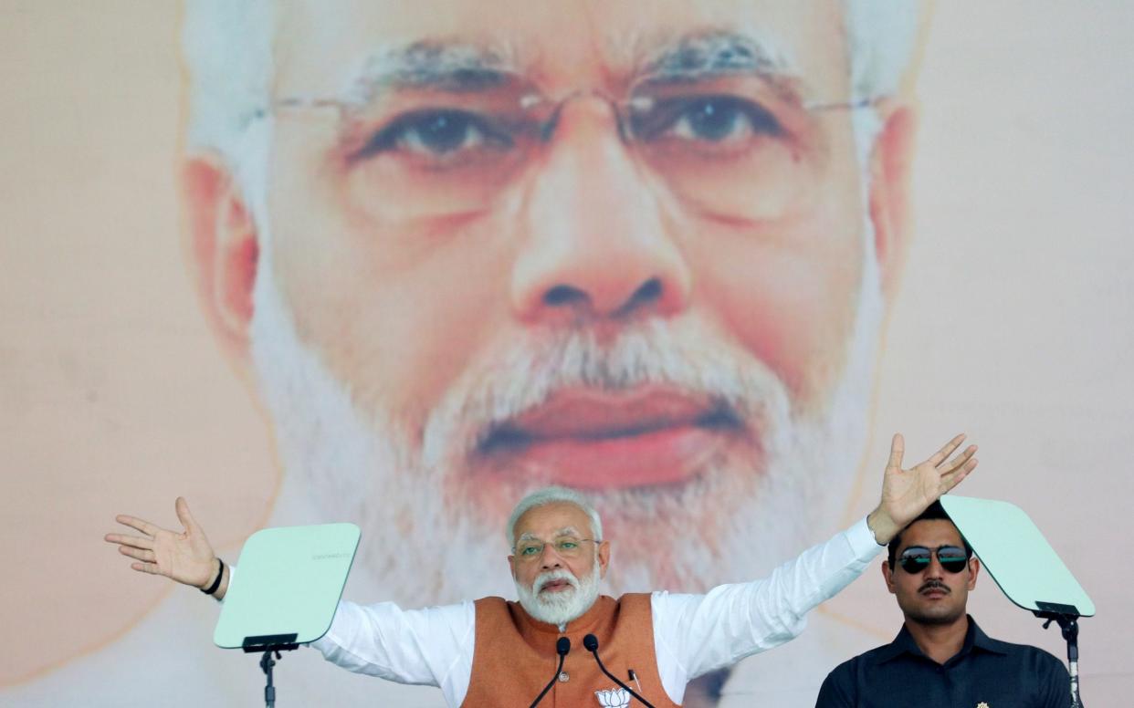 India's Prime Minister Narendra Modi gestures as he addresses an election campaign rally in Meerut - REUTERS