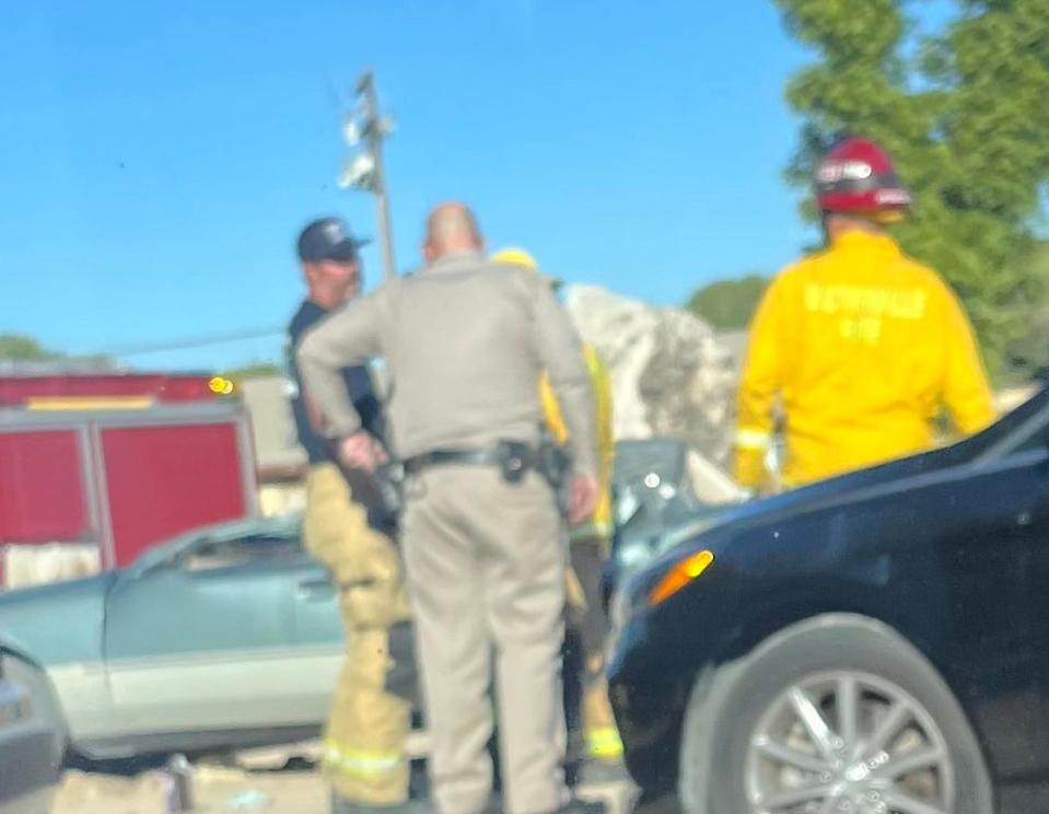 A man was killed and a woman suffered major injuries as excavating equipment landed on their vehicle near a railroad bridge on Old Route 66 in Oro Grande.