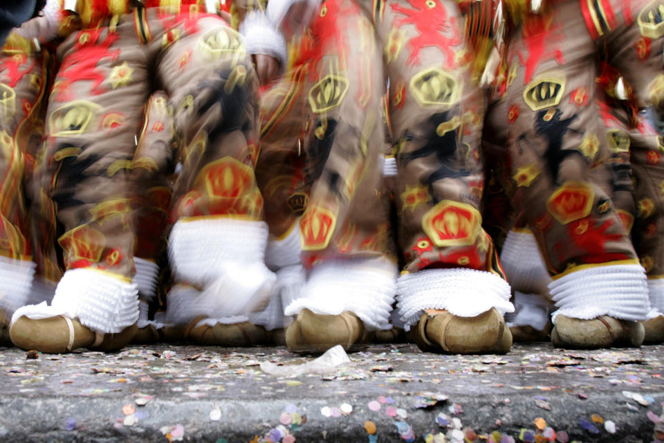 In this Tuesday, Feb. 24, 2009 file photo, traditional Gilles de Binche dance in their colorful costumes and wooden clogs, during the Mardi Gras festival in Binche, Belgium. The celebration, which heralds the return of spring, is said to date back to 1549 and was put on the UNESCO list in 2003, but in 2021 the COVID-19 regulations have forced the carnival to be cancelled.(AP Photo/Virginia Mayo, File)