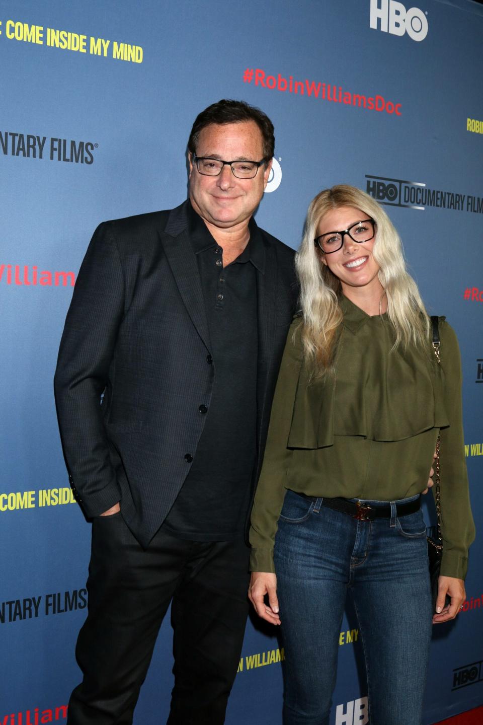 Bob Saget and Kelly Rizzo smiling.