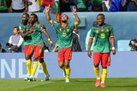 Cameroon's Jean-Charles Castelletto, center, celebrates after scoring his side's opening goal during the World Cup group G soccer match between Cameroon and Serbia, at the Al Janoub Stadium in Al Wakrah, Qatar, Monday, Nov. 28, 2022. (AP Photo/Frank Augstein)