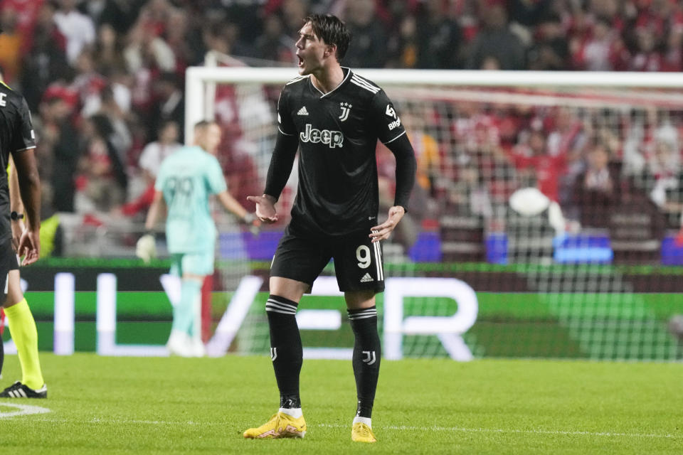 Juventus' Dusan Vlahovic reacts after scoring his team's first goal during the Champions League group H soccer match between SL Benfica and Juventus at the Luz stadium in Lisbon, Tuesday, Oct. 25, 2022. (AP Photo/Armando Franca)