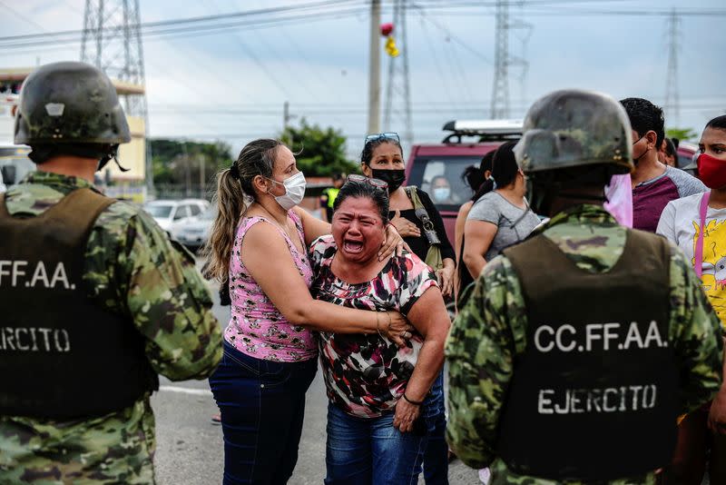 A woman reacts outside a prison where inmates were killed during a riot that the government described as a concerted action by criminal organisations, in Guayaquil