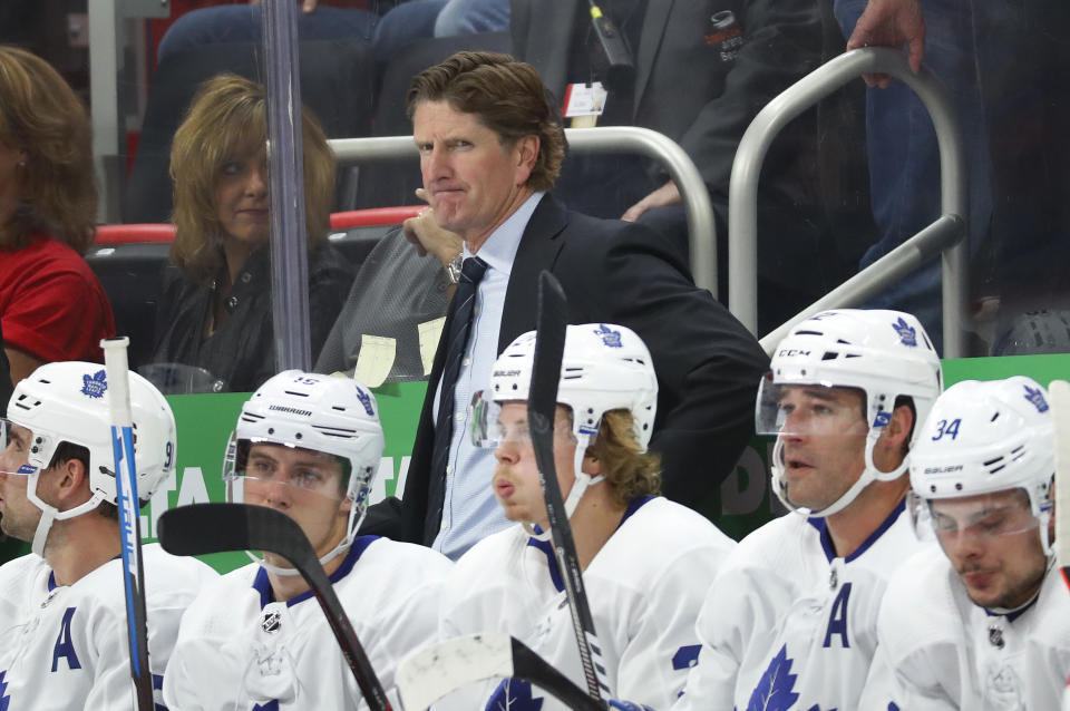 Toronto Maple Leafs coach Mike Babcock watches during the first period of the team's NHL hockey game against the Detroit Red Wings, Thursday, Oct. 11, 2018, in Detroit. (AP Photo/Paul Sancya)