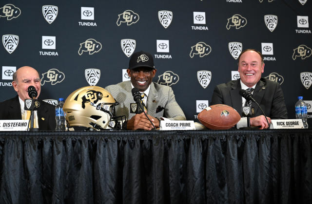 Deion Sanders is announced as Colorado&#39;s new head football coach alongside Phil DiStefano (L) and athletic director Rick George on Dec. 4. (Helen H. Richardson/MediaNews Group/The Denver Post via Getty Images)