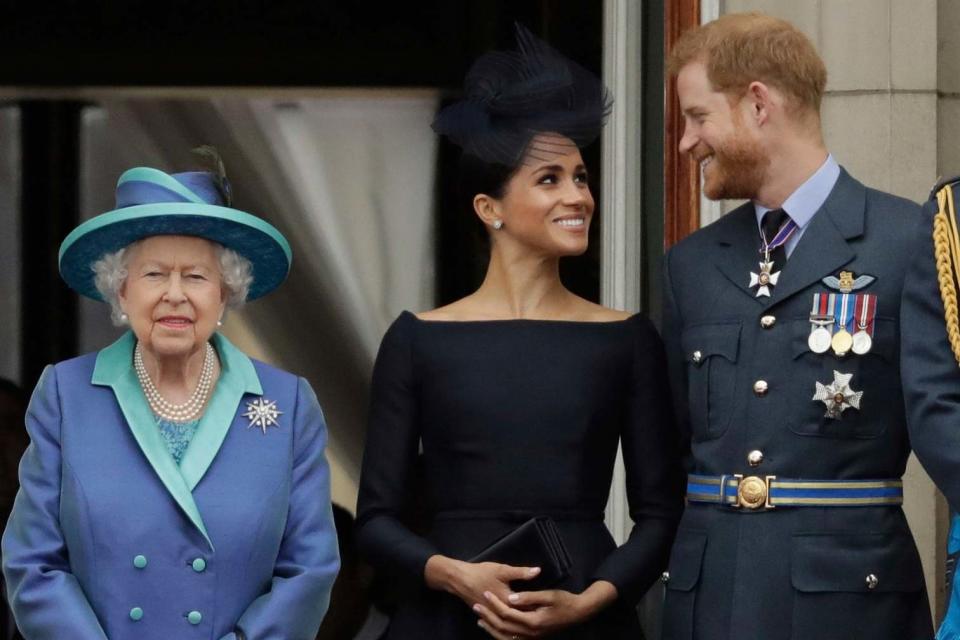 The Queen stands with the Duke and Duchess of Sussex (AP)