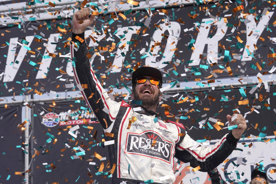 Martin Truex Jr., celebrates his win in the Crayon 301 NASCAR Cup Series auto race, Monday, July 17, 2023, at New Hampshire Motor Speedway, in Loudon, N.H. (AP Photo/Steven Senne)