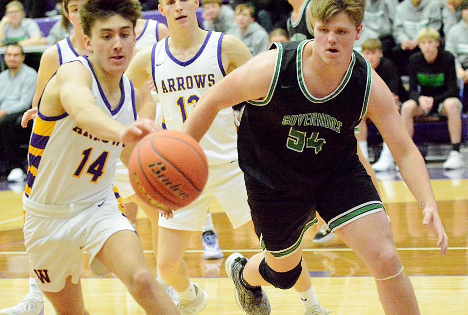 Watertown's Will Engstrom (14) tracks down a loose ball in front of Pierre's Christian Busch during their Eastern South Dakota Conference boys basketball game on Tuesday, Dec. 20, 2022 in the Watertown Civic Arena. Pierre won 64-46.