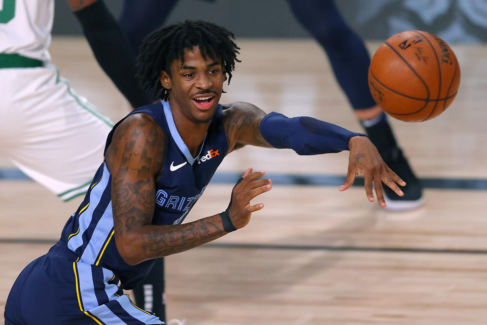 Ja Morant passes the ball.